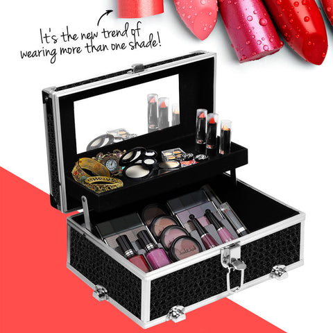 Makeup case with various cosmetic items and red lipsticks on a white background
