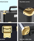 Black suitcase with gold hardware on a light blue background, highlighting features like aluminium frame, rounded corners, sturdy joints, and non-slip rubber feet.