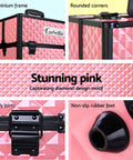 Pink makeup case with black frame and details on a pink geometric patterned background