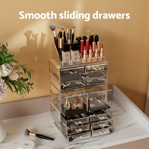 Makeup organizer with various cosmetic items on a marble surface with a beige wall background.