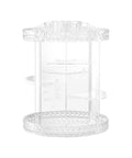 Clear plastic cylindrical organizer with multiple shelves on a white background