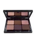 Makeup palette with nine square shades of brown and beige on a white background