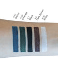 Color swatches on a wrist with labeled colors including Denim, Emerald, Black, Dark Brown, and White.
