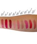 Lipstick swatches on a arm with color names listed