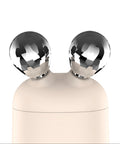 Decorative object with two metallic spheres on a white background