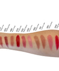 Lipstick swatches on a person's arm with color names labeled