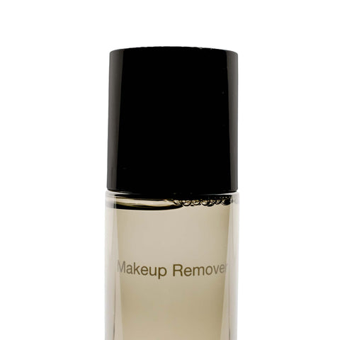 Makeup remover bottle with black cap on a white background