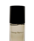 Makeup remover bottle with black cap on a white background