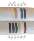 Color swatches of a makeup product on a arm with labeled shades.