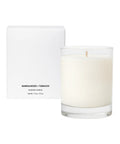 Sandalwood + Tobacco scented candle with packaging on a white background