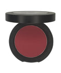 Compact blush in a black case on a white background