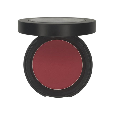 Compact blush in a black case on a white background