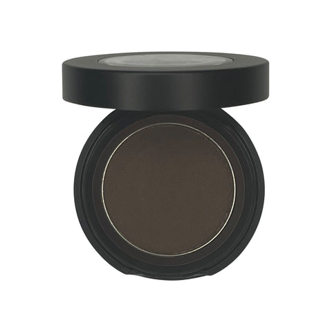 Compact powder in a black case on a white background