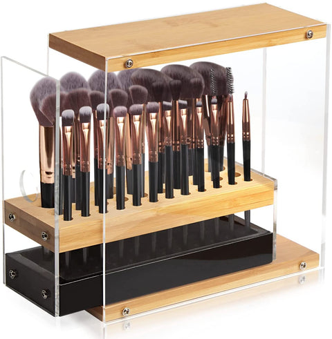 Makeup brush set in a wooden and acrylic stand on a white background