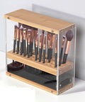 Makeup brush set in a wooden and acrylic holder on a white background