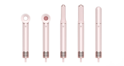Set of five pink hair straightening tools with different barrel sizes on a white background