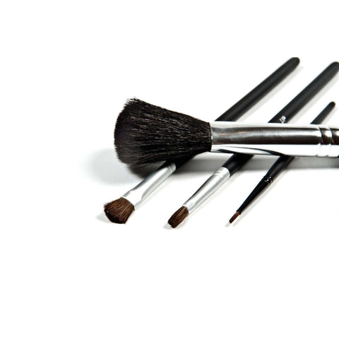 Set of makeup brushes on a white background
