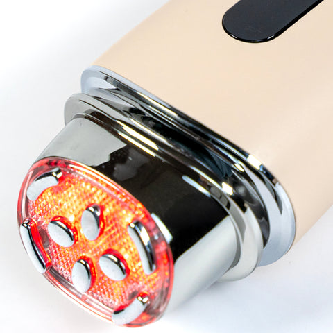 Close-up of a motorcycle exhaust with a glowing red tip on a white background